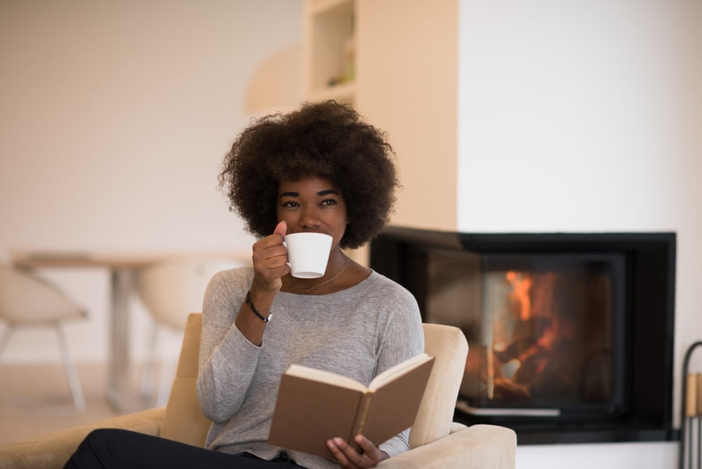 Woman Reading Book at Home